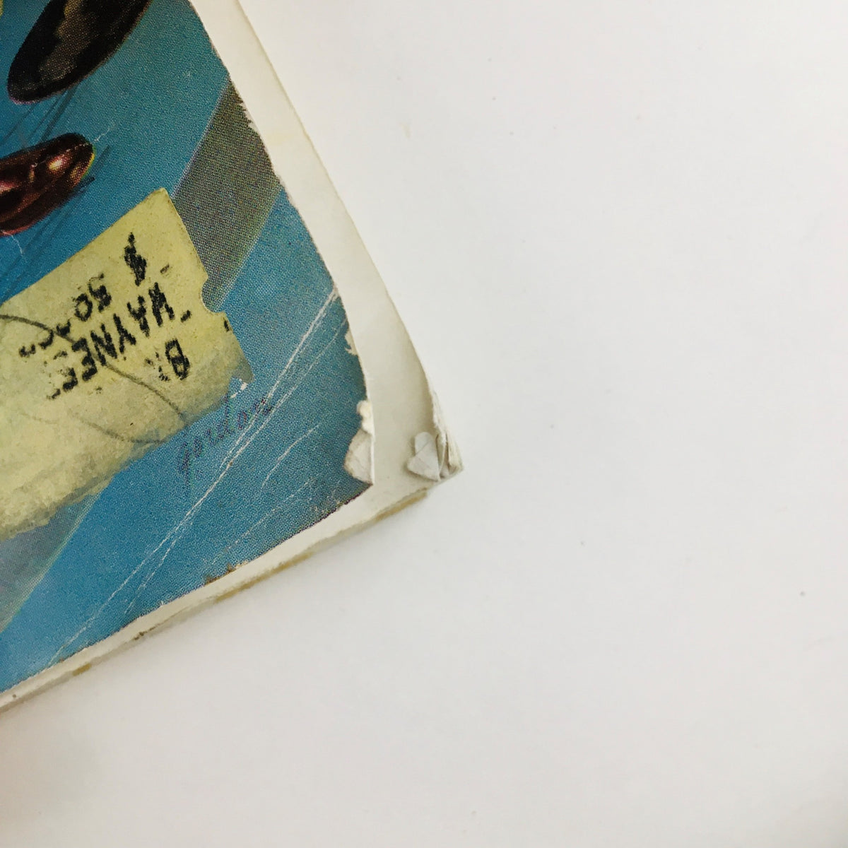 Close-up of a vintage magazine cover corner with slight damage, featuring The American Magazine June 1952 How To Get Along In The Army by Curt Simmons.