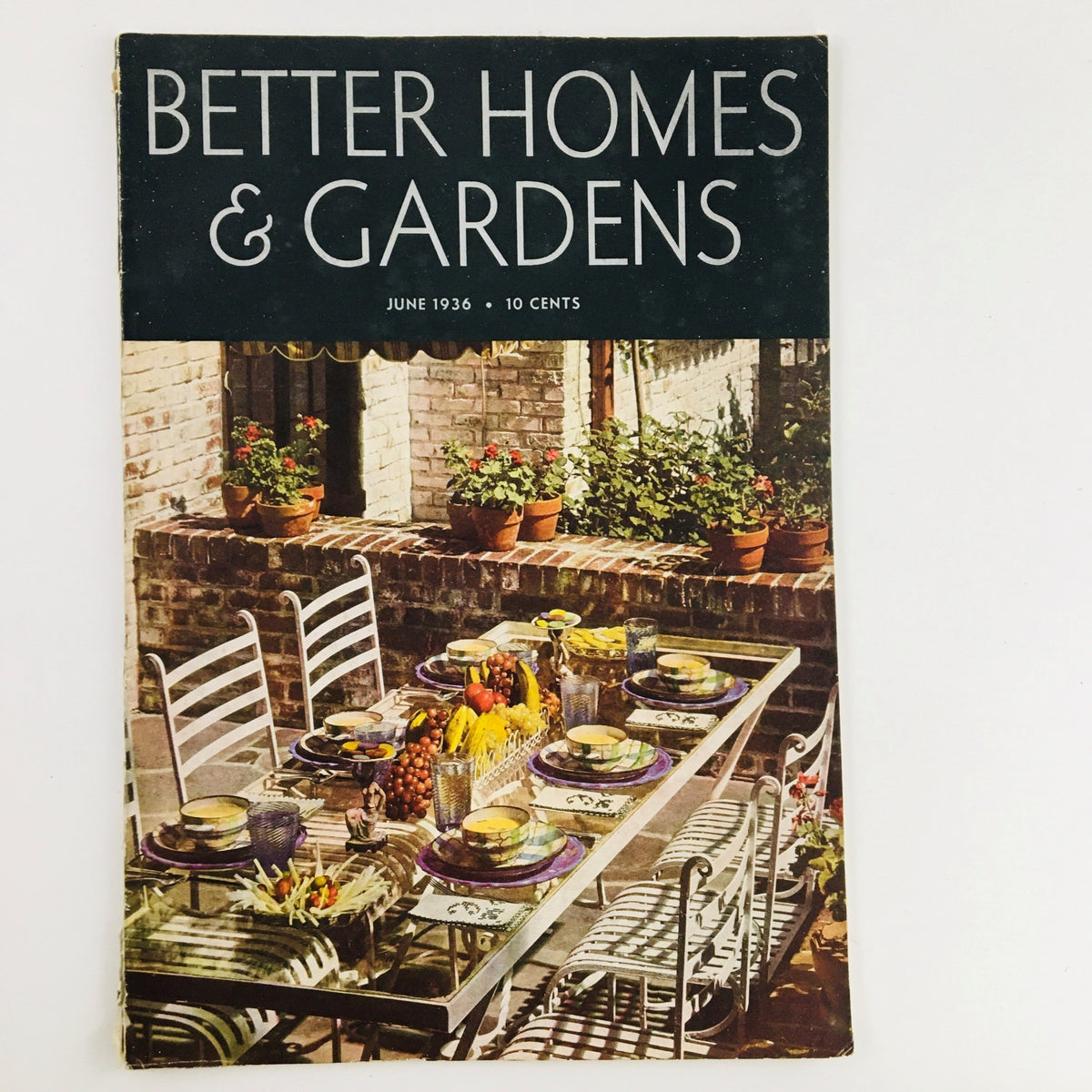 Cover of Better Homes & Gardens Magazine June 1936 featuring a picturesque dining table setting, reflecting vintage gardening aesthetic and home decor.