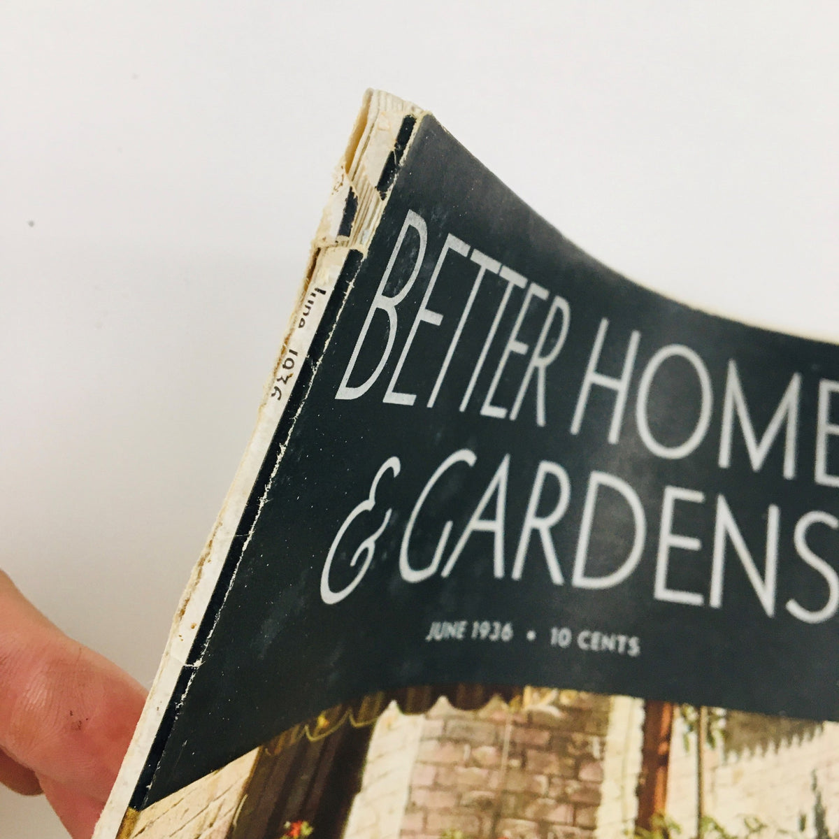 Close-up of the spine of Better Homes & Gardens Magazine June 1936, showing wear and age characteristic of vintage publications.