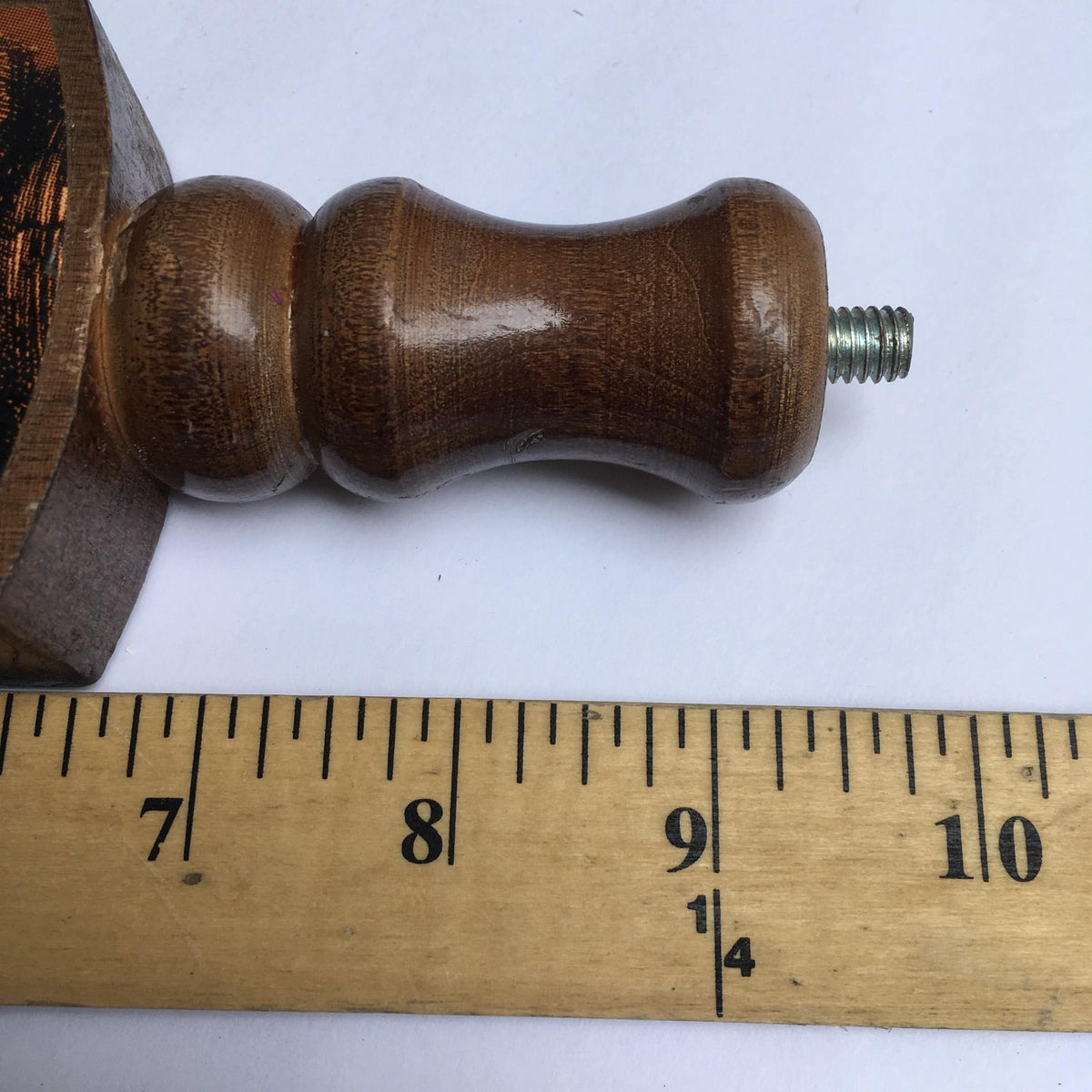Close-up view of the bottom of the Vintage Ruffian Porter Wooden 10" Beer Tap Handle with a threaded end, designed for easy attachment to draft beer systems.