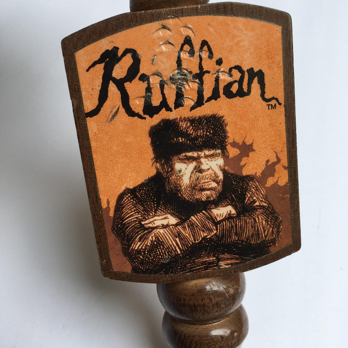 Detailed illustration on the Vintage Ruffian Porter Wooden 10" Beer Tap Handle capturing the essence of the Ruffian brand, perfect for enhancing home bar decor.