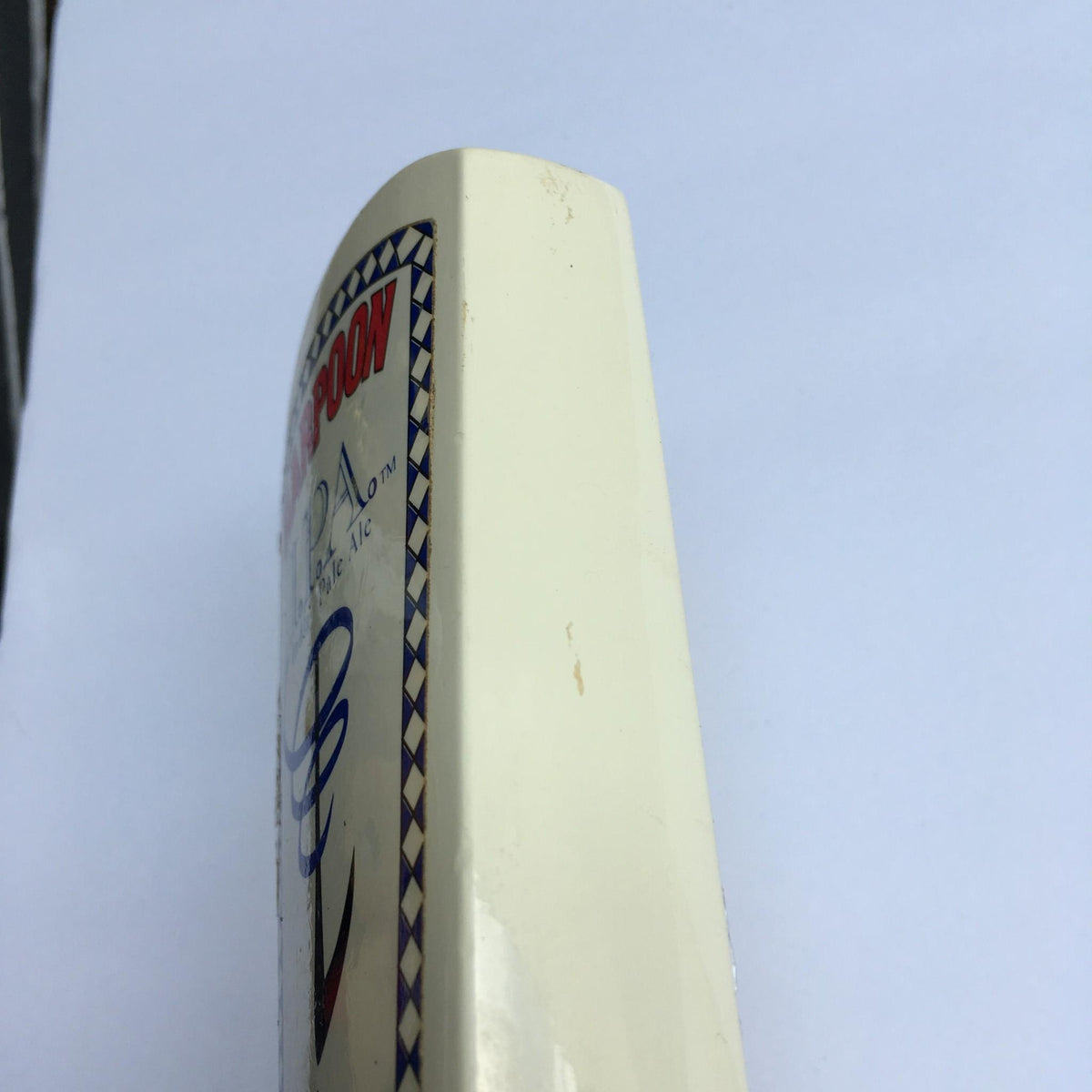 Side angle of the Vintage Harpoon IPA Indian Pale Ale beer tap handle, featuring its design and slight imperfections from previous use.