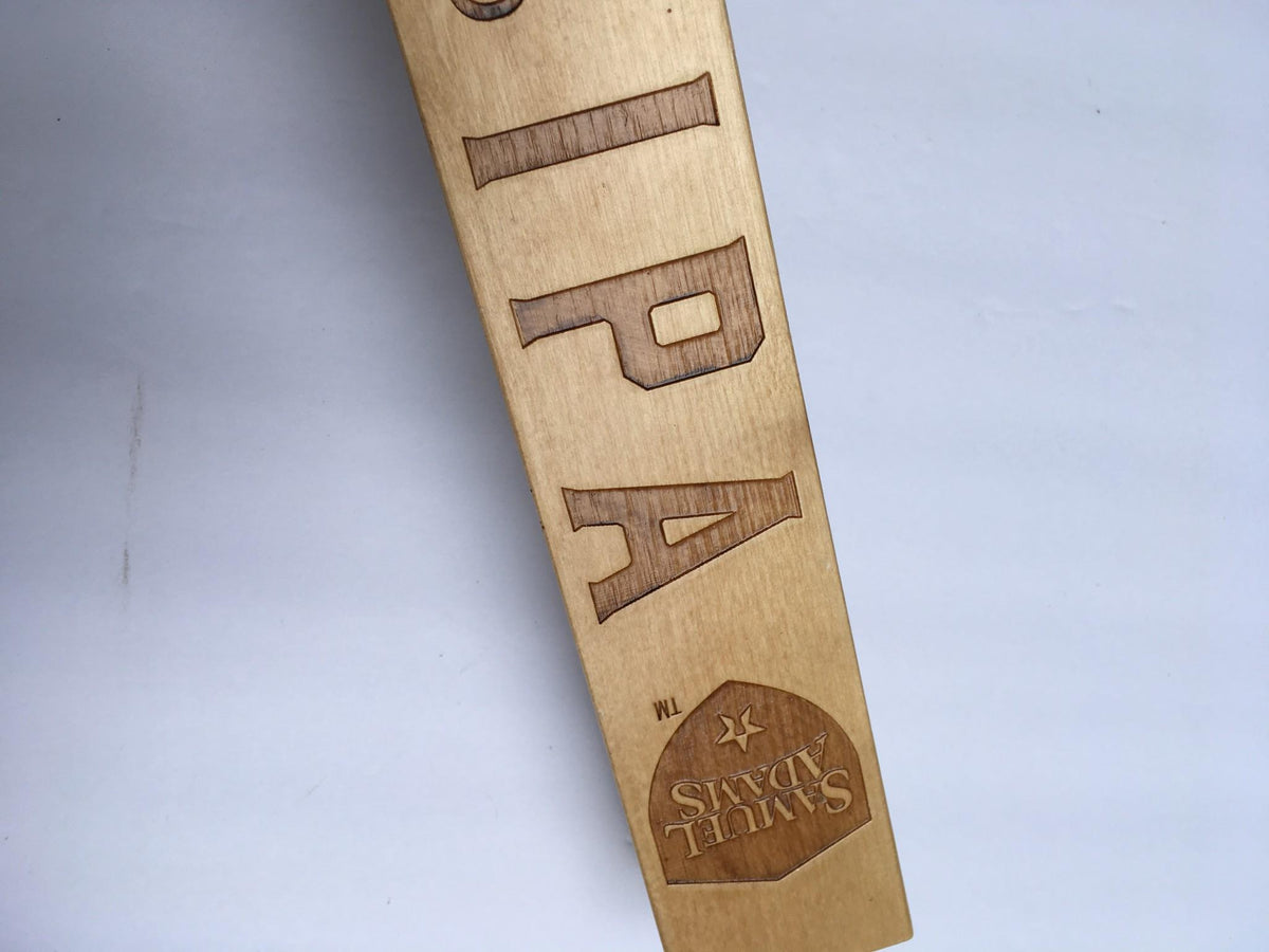 Image highlighting the engraved text 'IPA' and the Samuel Adams logo on the Vintage Samuel Adams New England IPA 13" Beer Tap Handle.