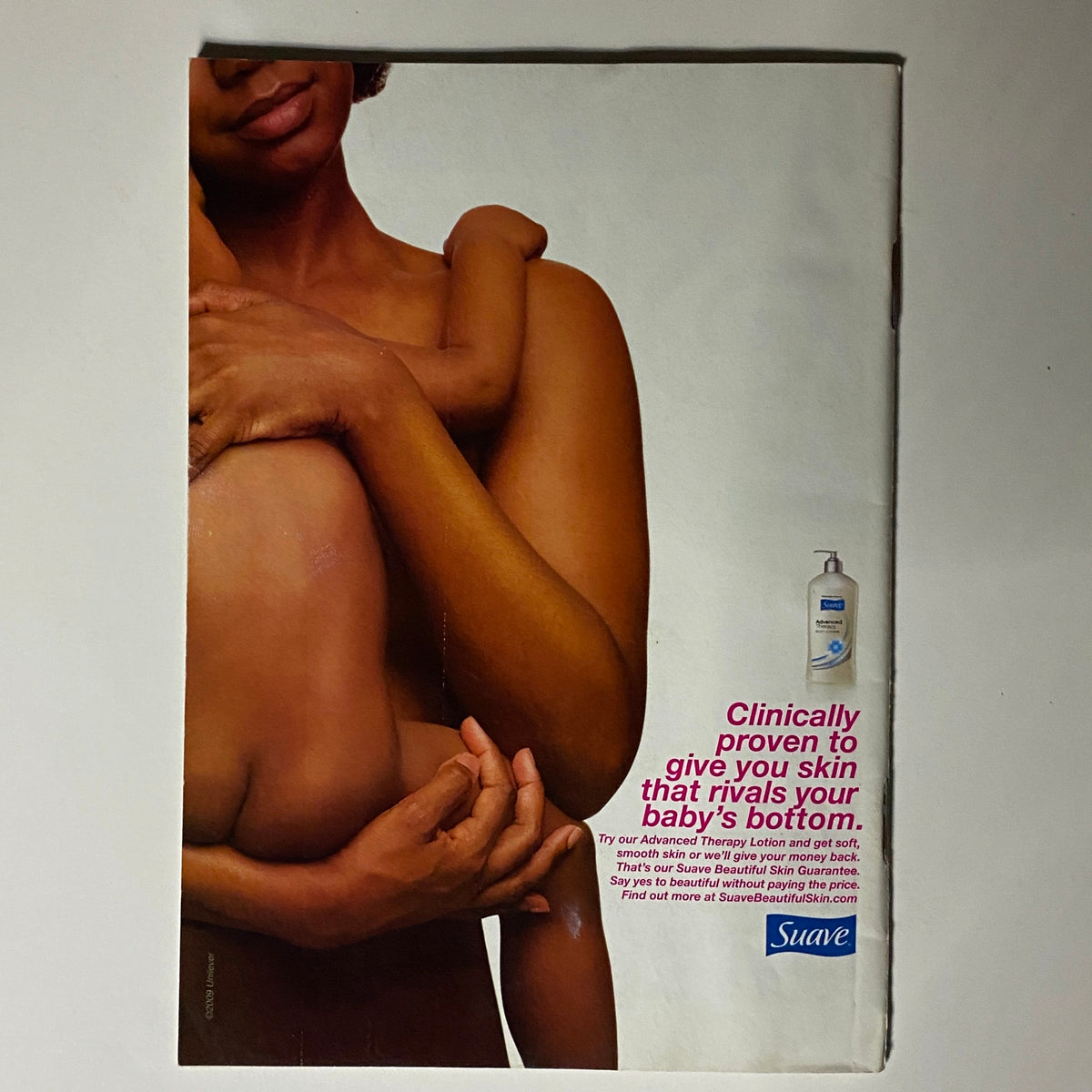 Advertisement page from Jet Magazine October 5-12, 2009 Vol 116 No. 7/8 promoting Suave lotion, showcasing a close-up of a mother holding her child.