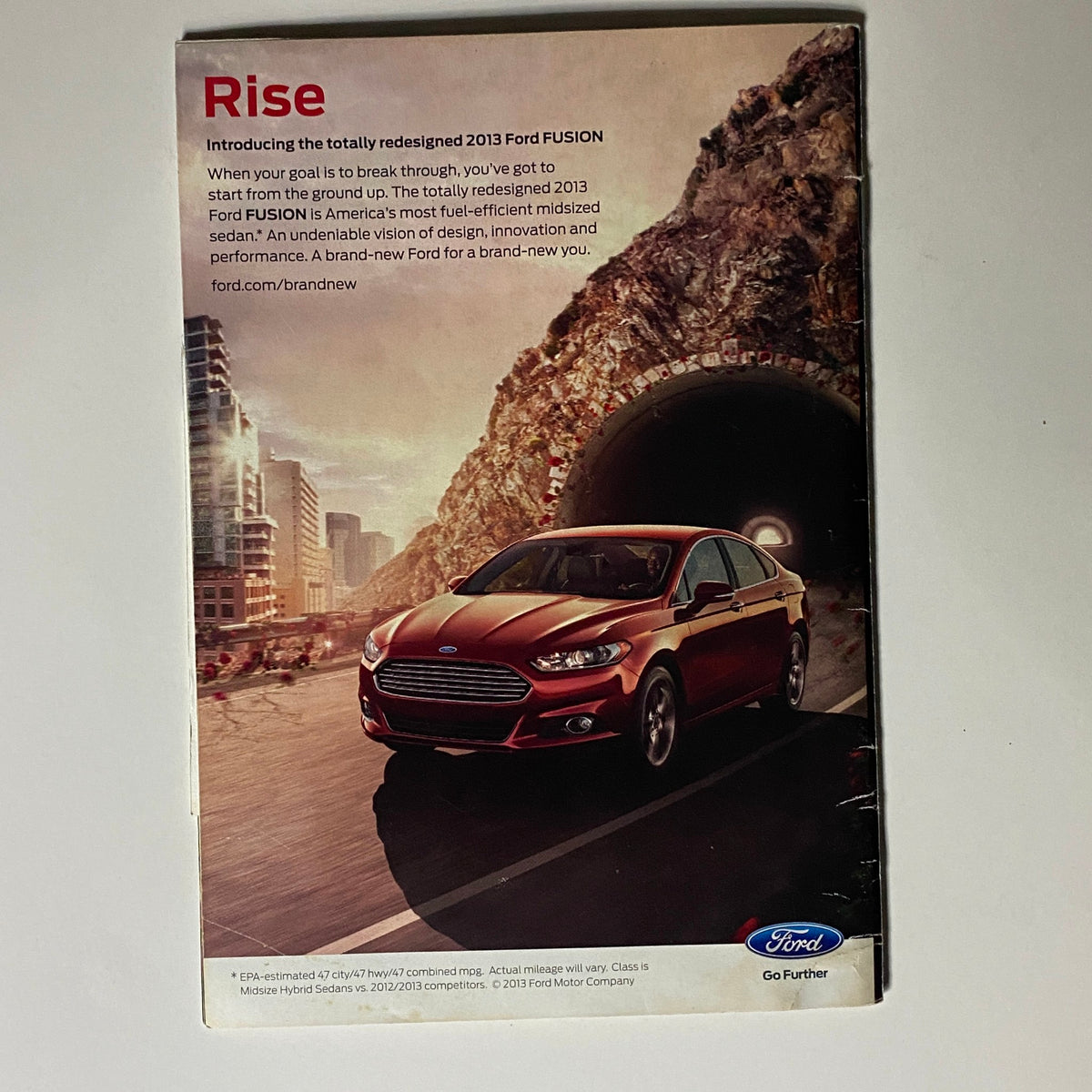Promotional image from Jet Magazine April 29, 2013 Vol 122 No. 7 featuring the redesigned 2013 Ford Fusion, showcasing its sleek design and modern features.