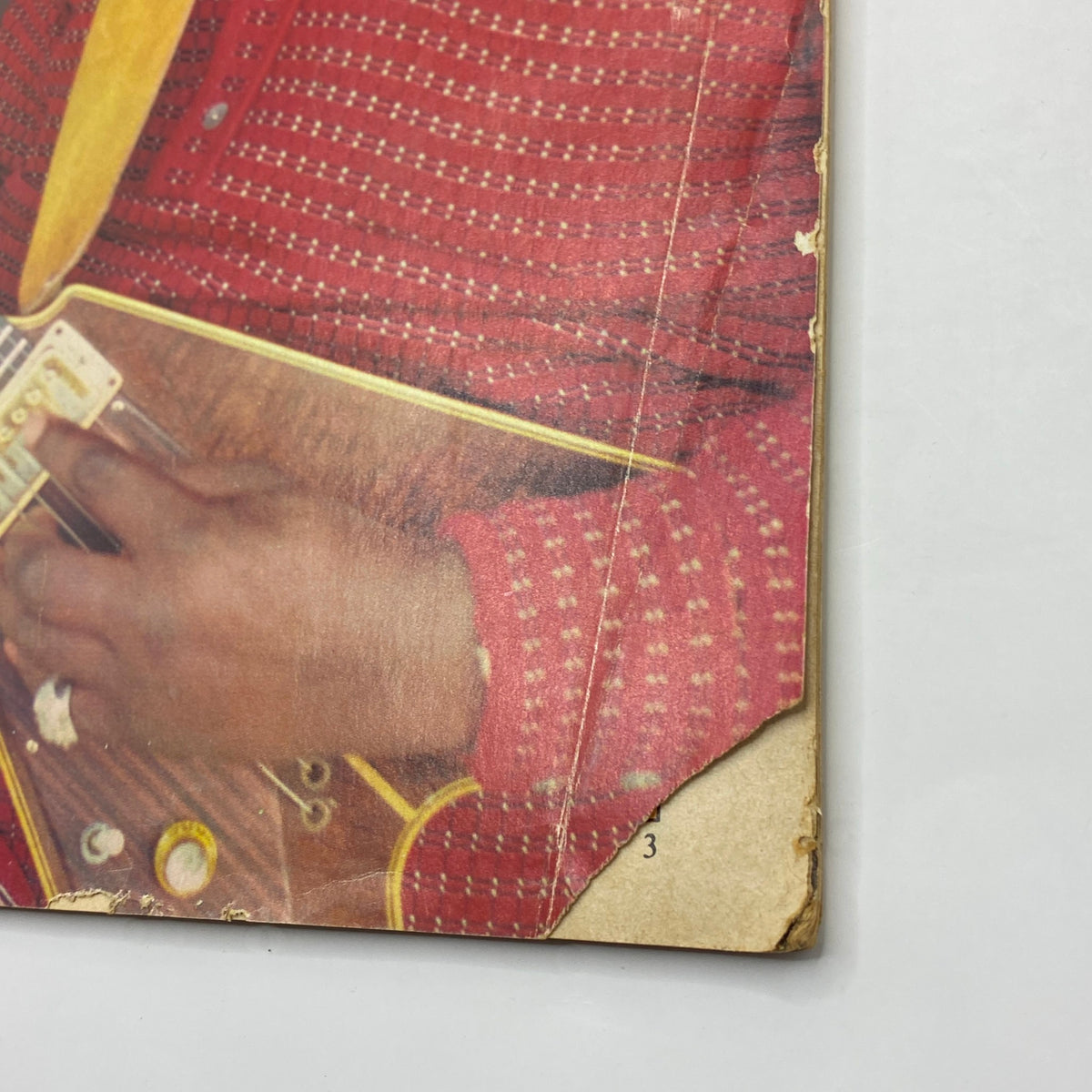 Close-up image of the edge of Guitar Player Magazine from September 1977, showcasing wear and details of the cover featuring Albert King.