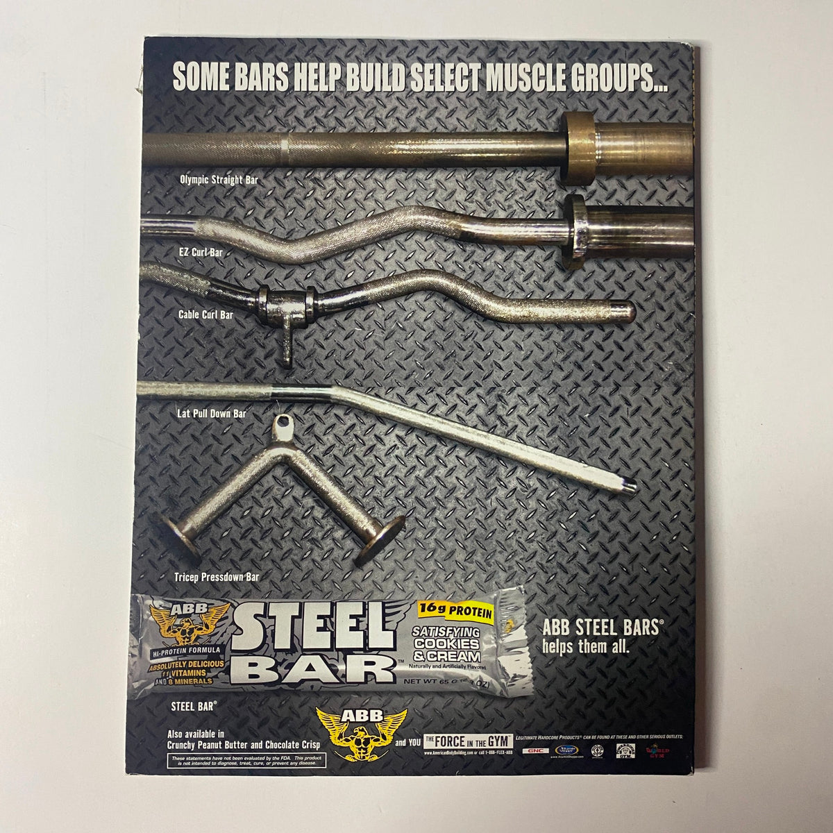 Back cover of Muscle & Fitness Magazine 2004 highlighting ABB Steel Bars for strength training, including images of different bar types for workouts.
