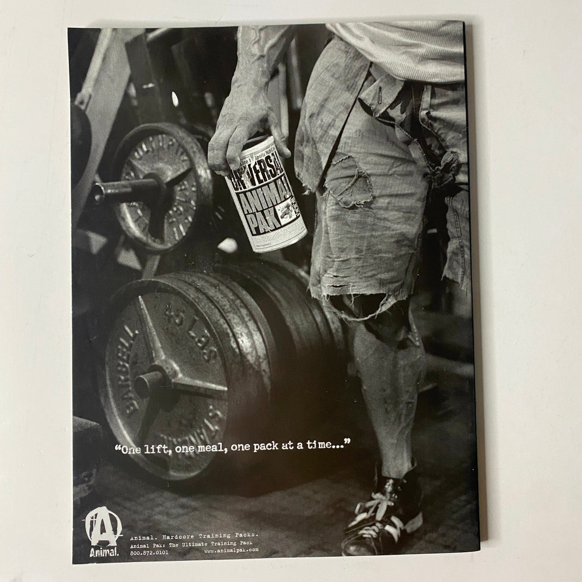Muscle & Fitness Magazine June 2005 Vol 66 No. 6 showing an advertisement with a fitness enthusiast lifting weights, promoting the product 'Animal Pak' with the tagline 'One lift, one meal, one pack at a time...'.