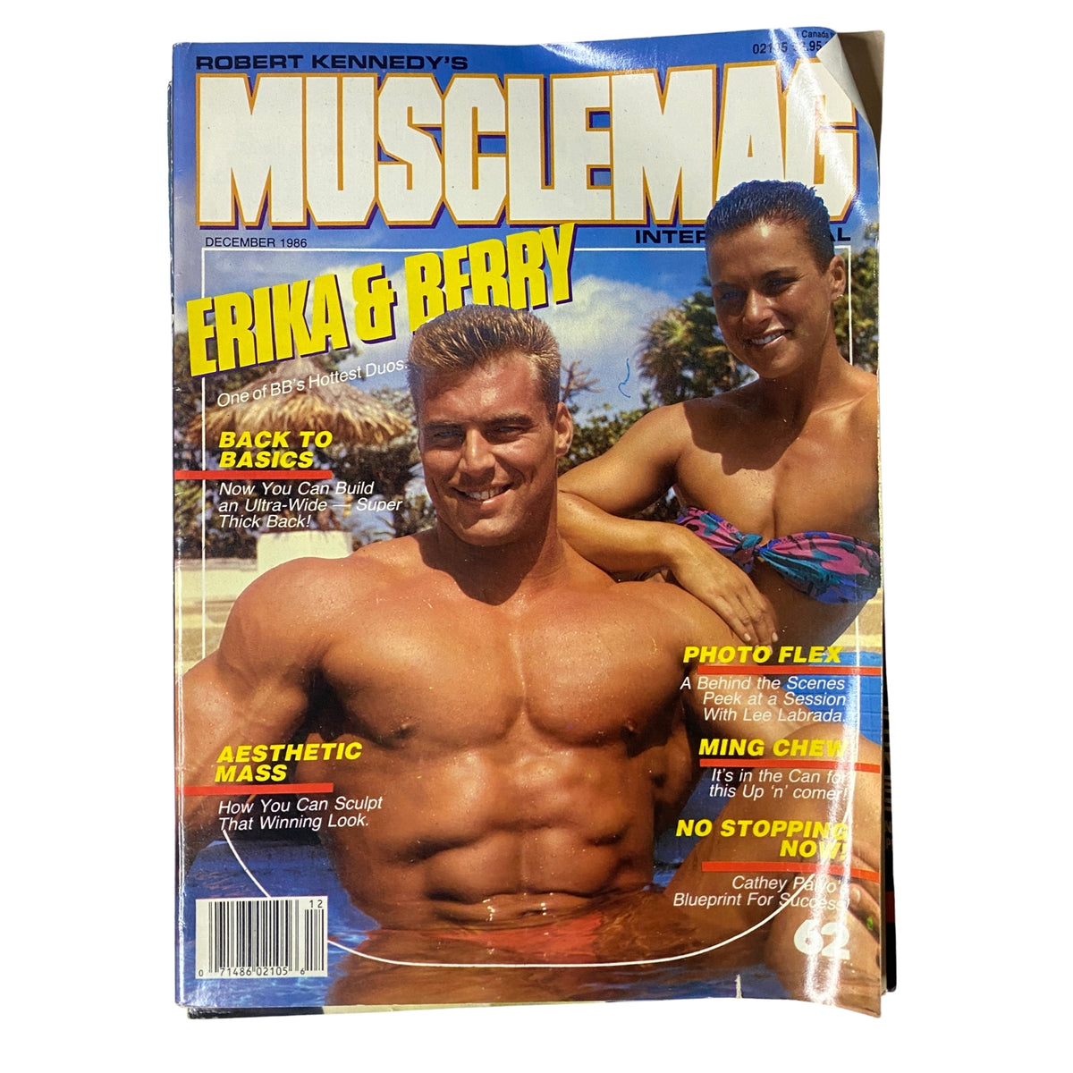 Cover of MuscleMag International Magazine December 1986 featuring Erika Mes and Berry DeMey, showcasing their bodybuilding prowess and article highlights.