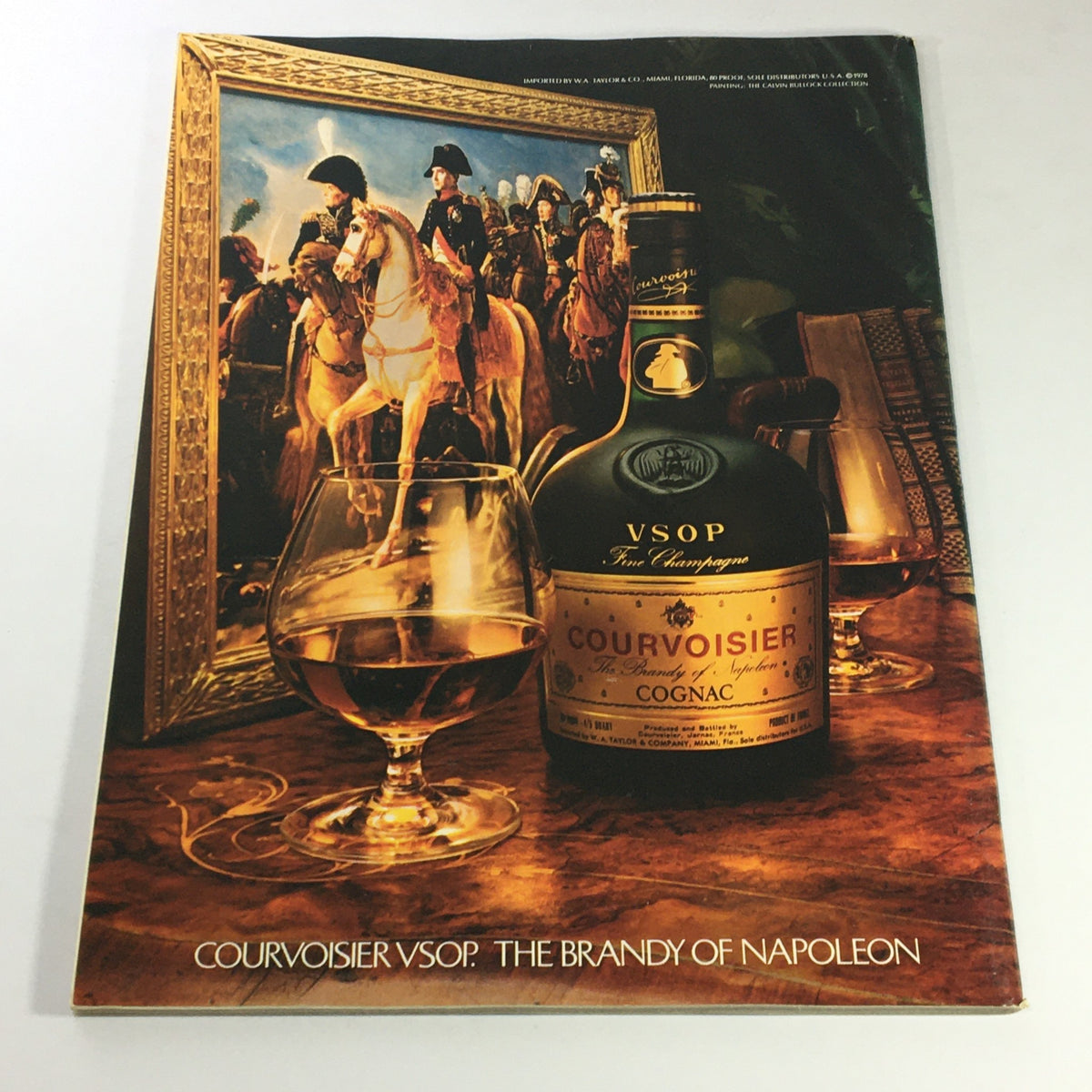 Vintage advertisement for Courvoisier VSOP, featuring a bottle of cognac and a glass, set against a historical backdrop related to Napoleon, illustrating 'Gourmet The Magazine of Good Living May 1979 - Chez Don Camillo Cheese Tray'.