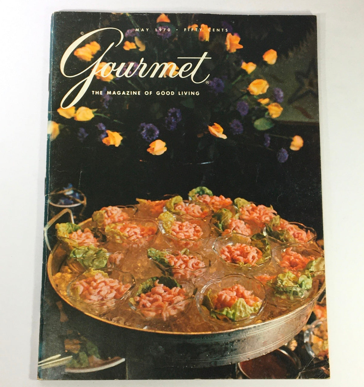 Cover of VTG Gourmet The Magazine of Good Living May 1970 featuring a gourmet dish arranged in a decorative platter with flowers in the background.