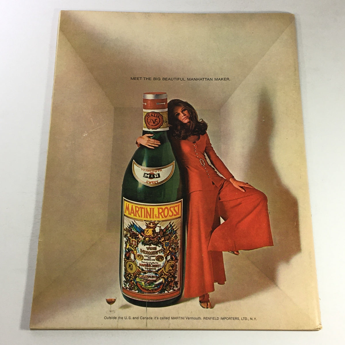 VTG Gourmet The Magazine of Good Living April 1969 back cover showcasing a vintage advertisement for Martini & Rossi vermouth with a model in a stylish red outfit.