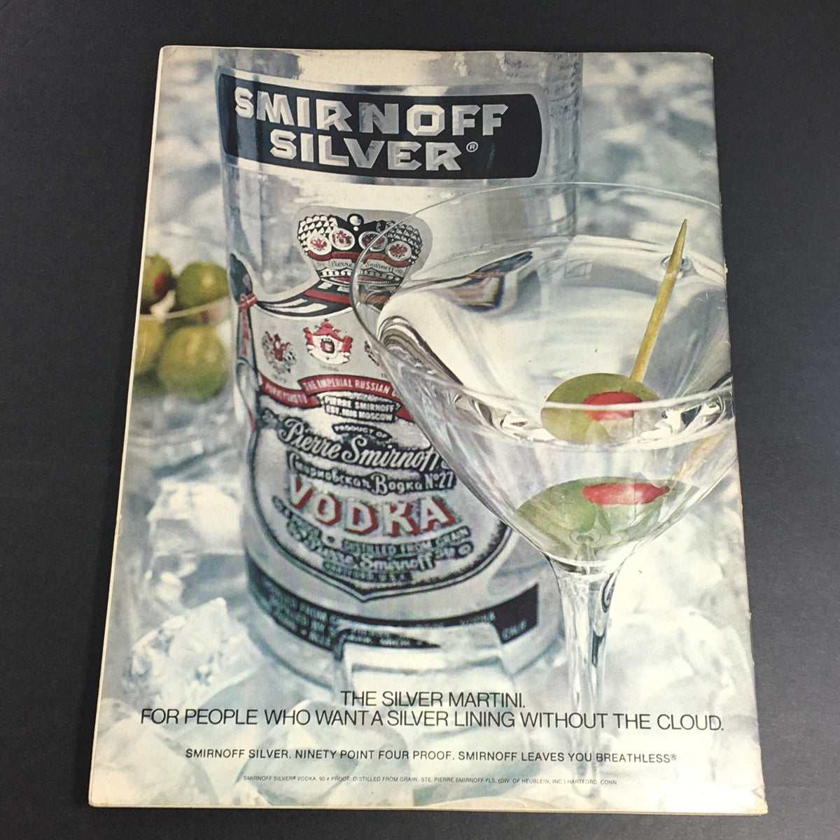 Back cover of VTG Gourmet The Magazine of Good Living April 1975 featuring a vintage advertisement for Smirnoff Silver vodka and a martini, highlighting the era's cocktail culture.