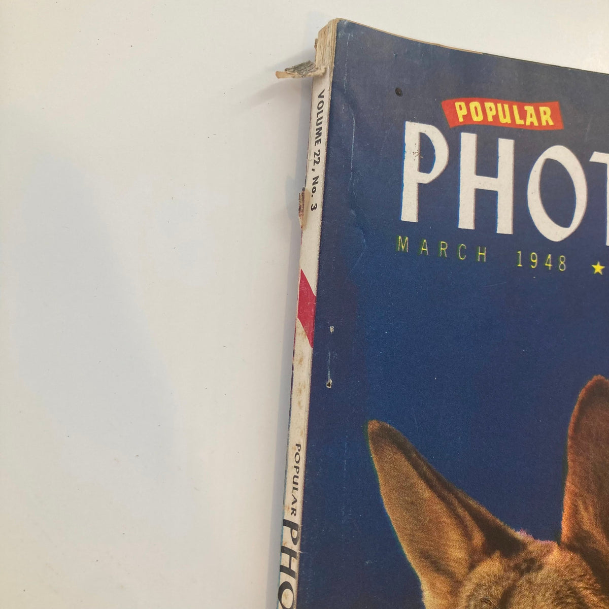 Spine view of VTG Popular Photography Magazine March 1948 Vol 22 #3, showing the vintage magazine title and the issue number.