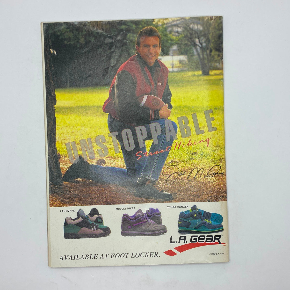 Inside Sports Magazine November 1990 featuring an advertisement for L.A. Gear shoes with a football-themed design. The cover showcases an athlete in outdoor gear, embodying the spirit of sports and adventure.