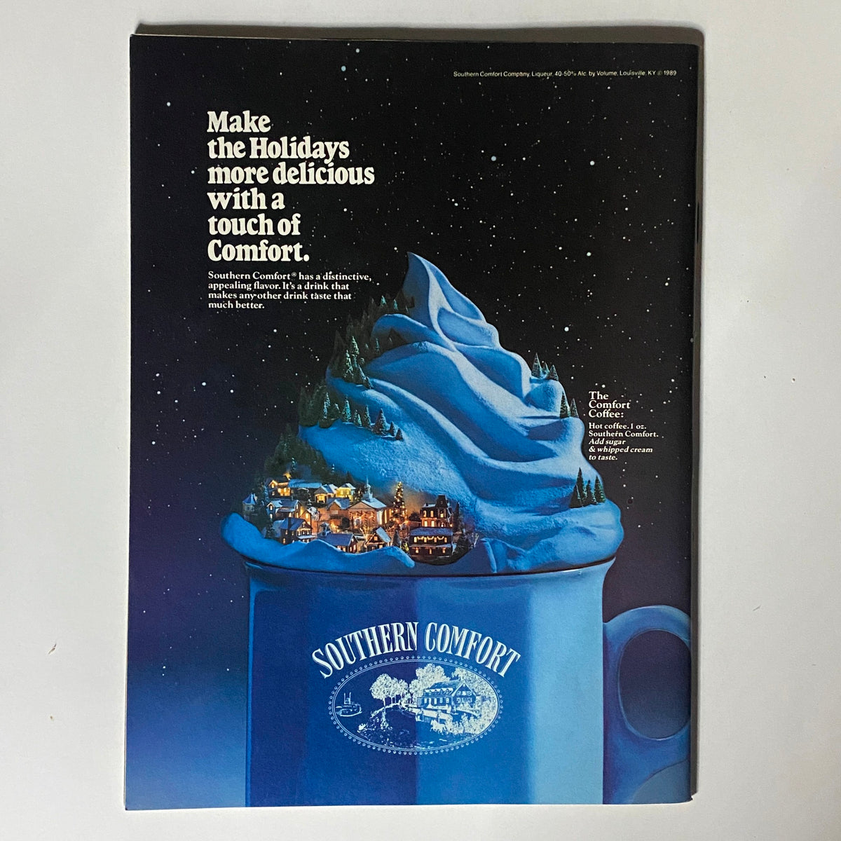Back cover of Inside Sports Magazine December 1989 featuring an advertisement for Southern Comfort, depicting a winter-themed drink with holiday imagery.