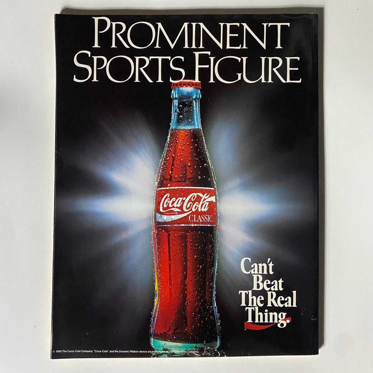 Back cover of NCAA Basketball Preview Magazine 1990-1991, featuring an advertisement for Coca-Cola Classic, emphasizing its status as a 'Prominent Sports Figure' in the 1990s.