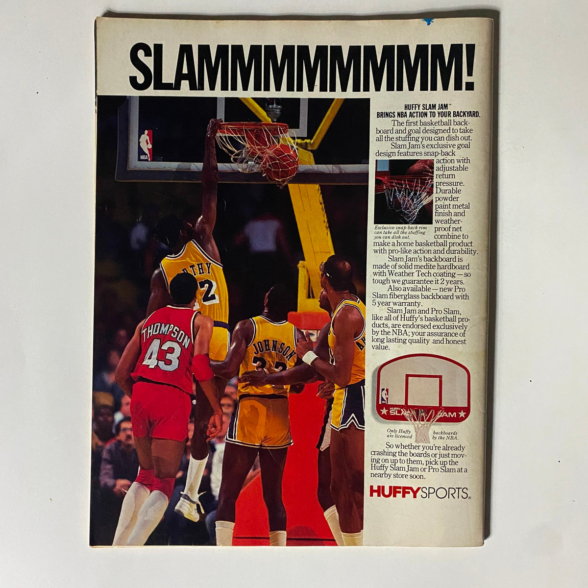 Basketball Digest 1986-87 Yearbook advertisement titled 'SLAMMMMMMMMMM!' showcasing a basketball product with players. This image illustrates the vibrant and dynamic nature of 1980s basketball culture.