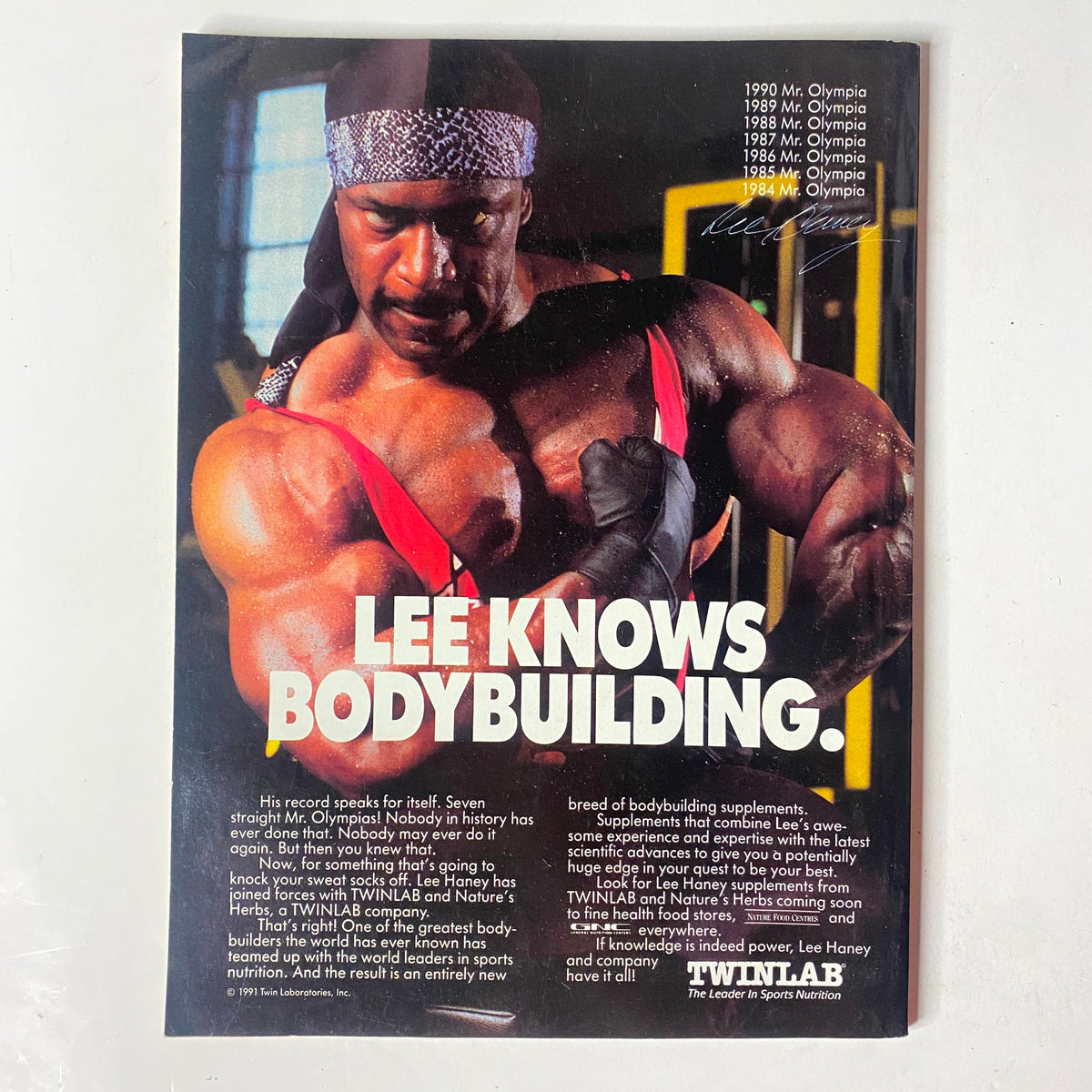 Back cover of MuscleMag International Magazine October 1991 No. 112, featuring Lee Haney promoting bodybuilding supplements and fitness advice.