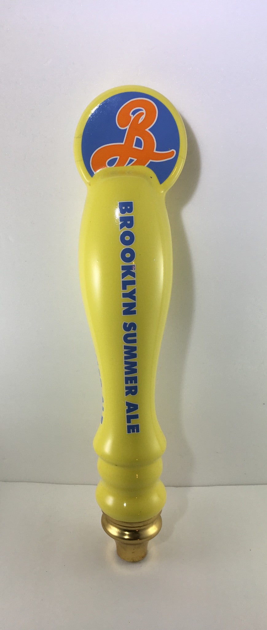Vintage Brooklyn Summer Ale 12½" beer tap handle, featuring a yellow design and distinctive logo, perfect for collectors or as a decorative piece.