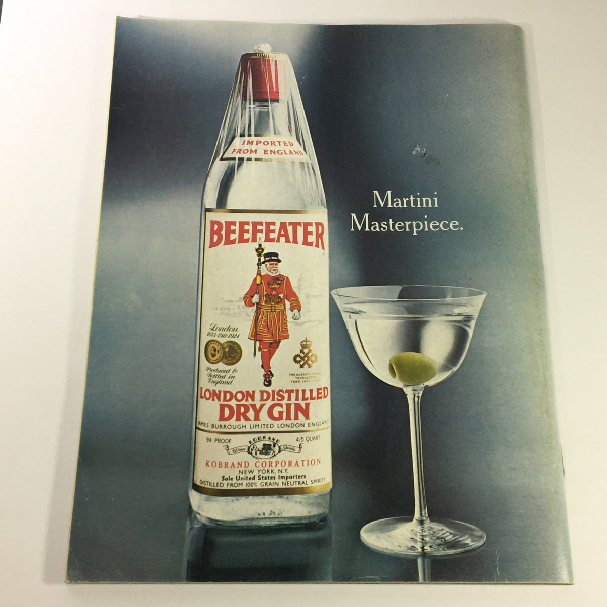 Advertisement for Beefeater London Distilled Dry Gin, showcasing a bottle and martini glass with olive, associated with the Gourmet Magazine March 1977 edition.