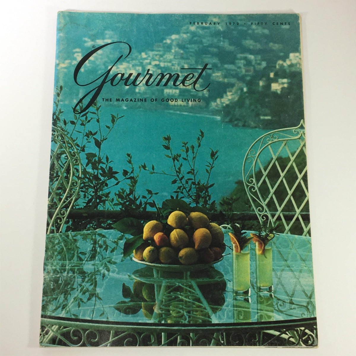 Cover of VTG Gourmet The Magazine of Good Living February 1972 showcasing a scenic view with fruits and beverages, highlighting Italian wine culture.