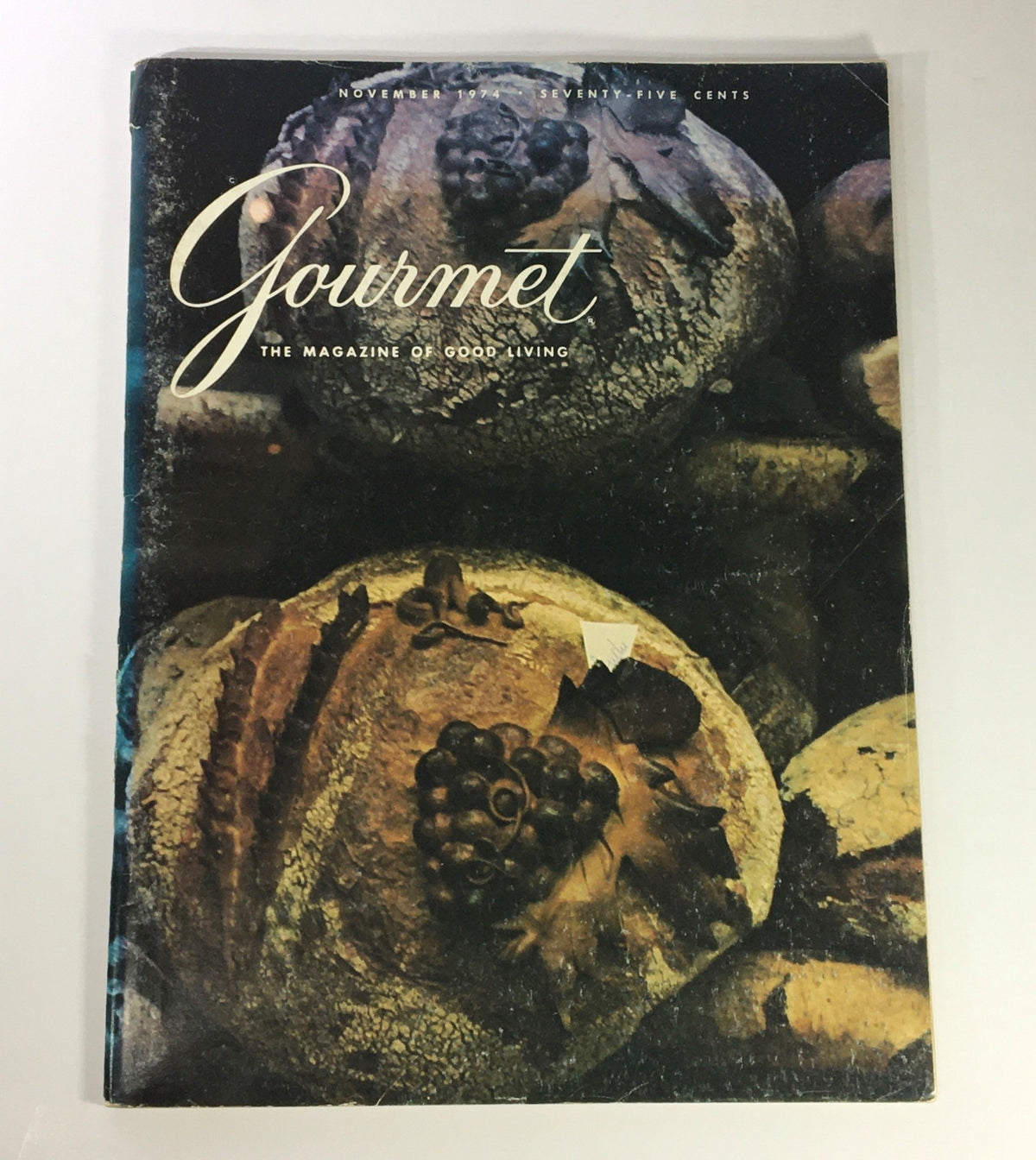 Cover of VTG Gourmet The Magazine of Good Living November 1974 featuring a vintage artistic depiction of bread and grapes, capturing the essence of Italian culinary artistry.