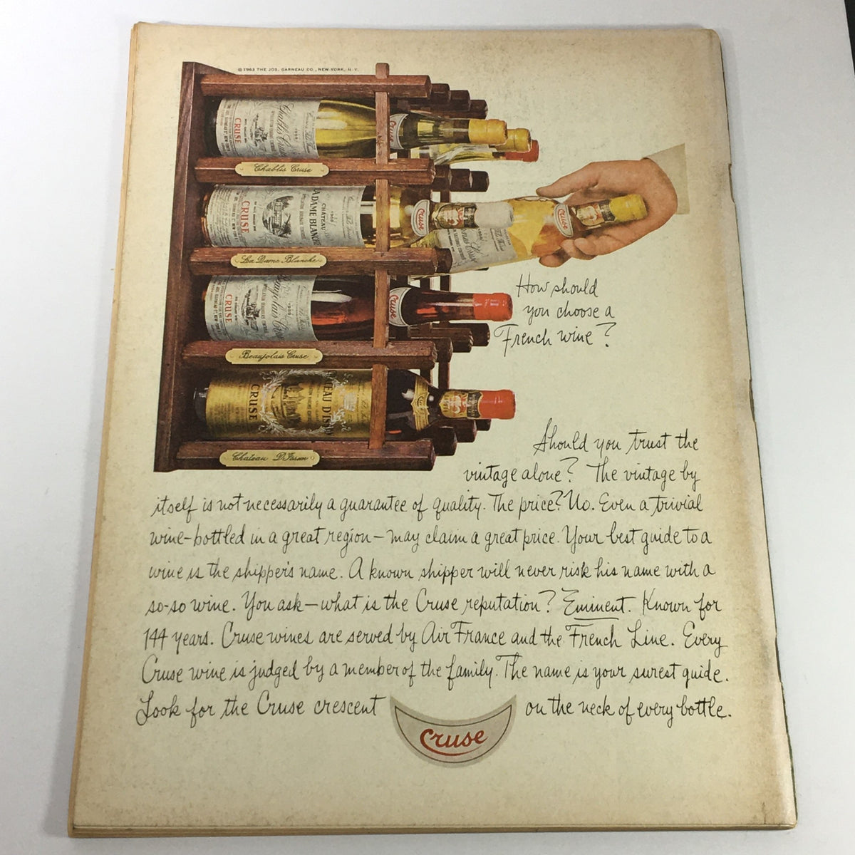 Back cover of VTG Gourmet Magazine - July 1967 illustrating a wooden wine rack with various wine bottles, discussing wine selection tips.