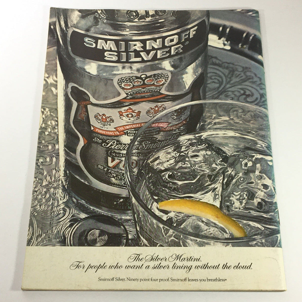 Advertisement from VTG Gourmet: The Magazine of Good Living, August 1973, showcasing Smirnoff Silver vodka with a glass of drink, representing sophisticated entertaining and cocktail culture of the era.