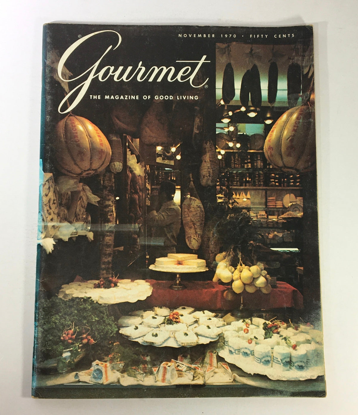 Cover of VTG Gourmet: The Magazine of Good Living, November 1970, showcasing a vibrant market scene with a display of cheeses and traditional Italian culinary items.