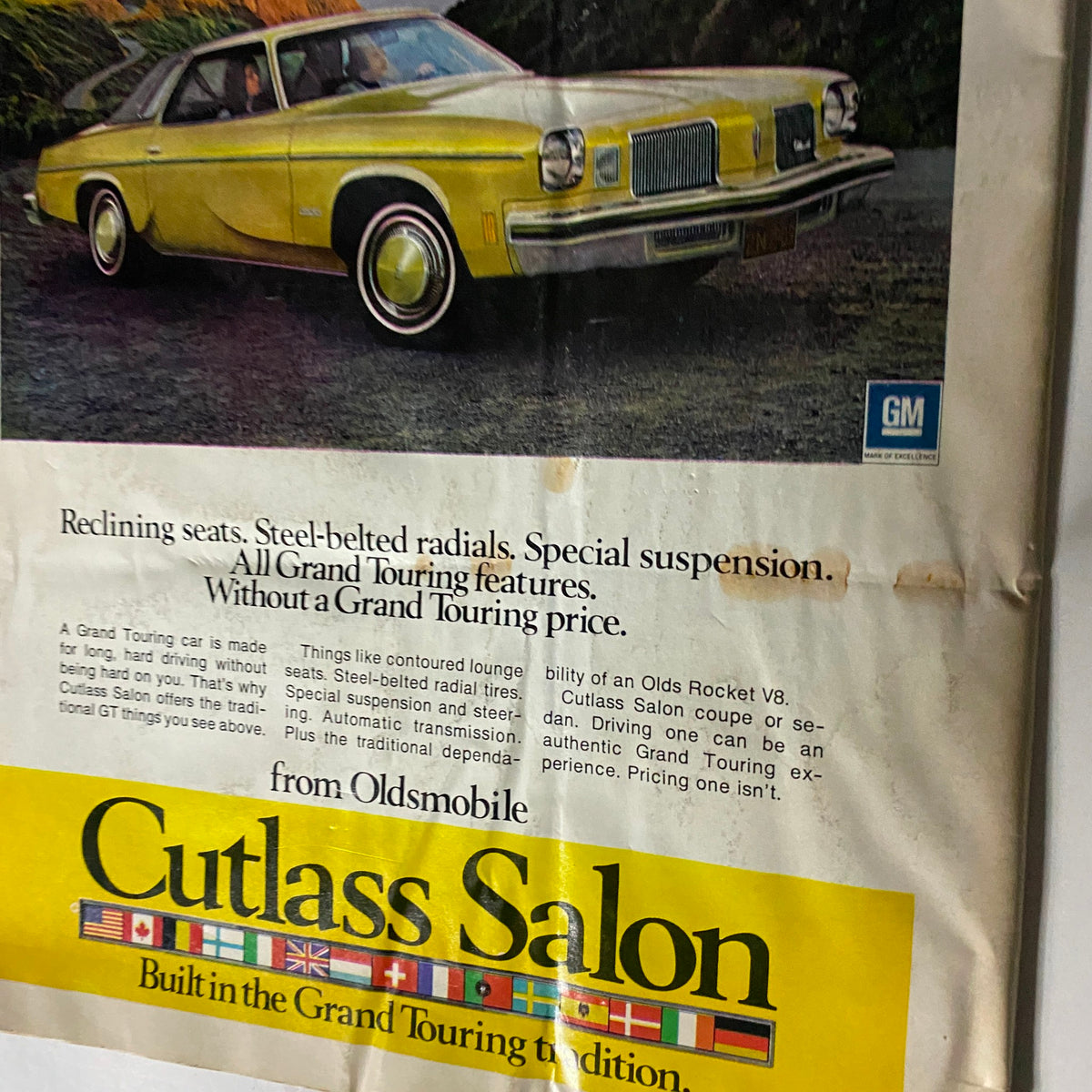 Vintage Rod Action Magazine from November 1973 featuring the prestigious Best Engineered Rod at Tulsa, with an advertisement for Oldsmobile Cutlass Salon showcasing its Grand Touring features.