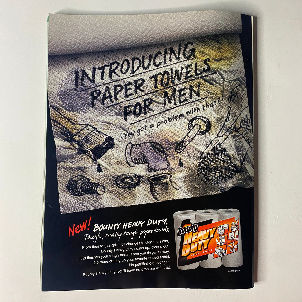 Advertisement for Bounty Heavy Duty paper towels featured in Muscle & Fitness Magazine November 1999, promoting toughness and reliability.