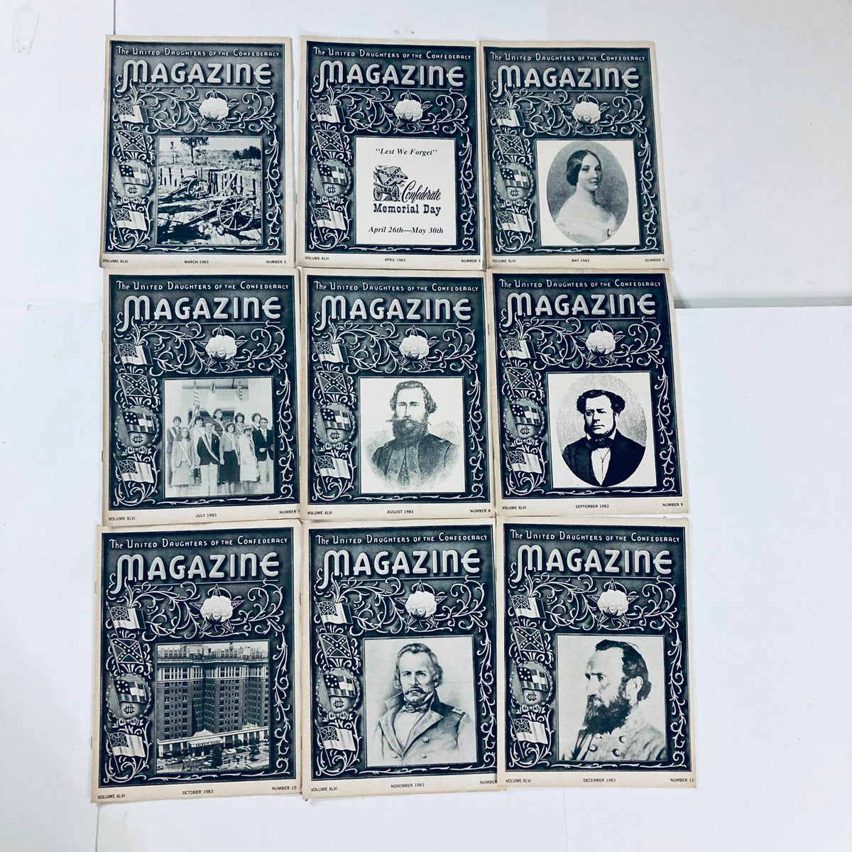 Nine vintage issues of The United Daughters of The Confederacy Magazine, with detailed covers commemorating significant events and figures in Confederate history.