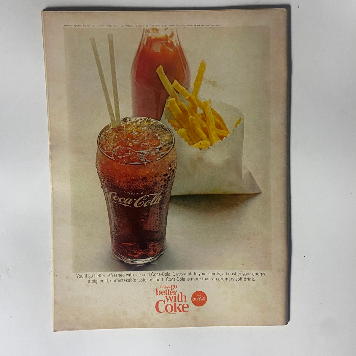 Vintage advertisement from VTG Motor Trend Magazine September 1965 promoting Coca-Cola and its refreshing taste, alongside a side of fries.