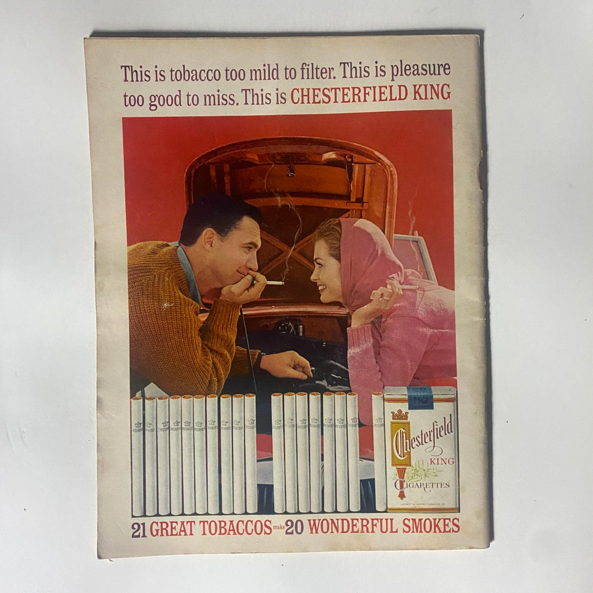 Vintage advertisement for Chesterfield King cigarettes from the 1962 Motor Trend Magazine, highlighting mid-20th century marketing aesthetics.