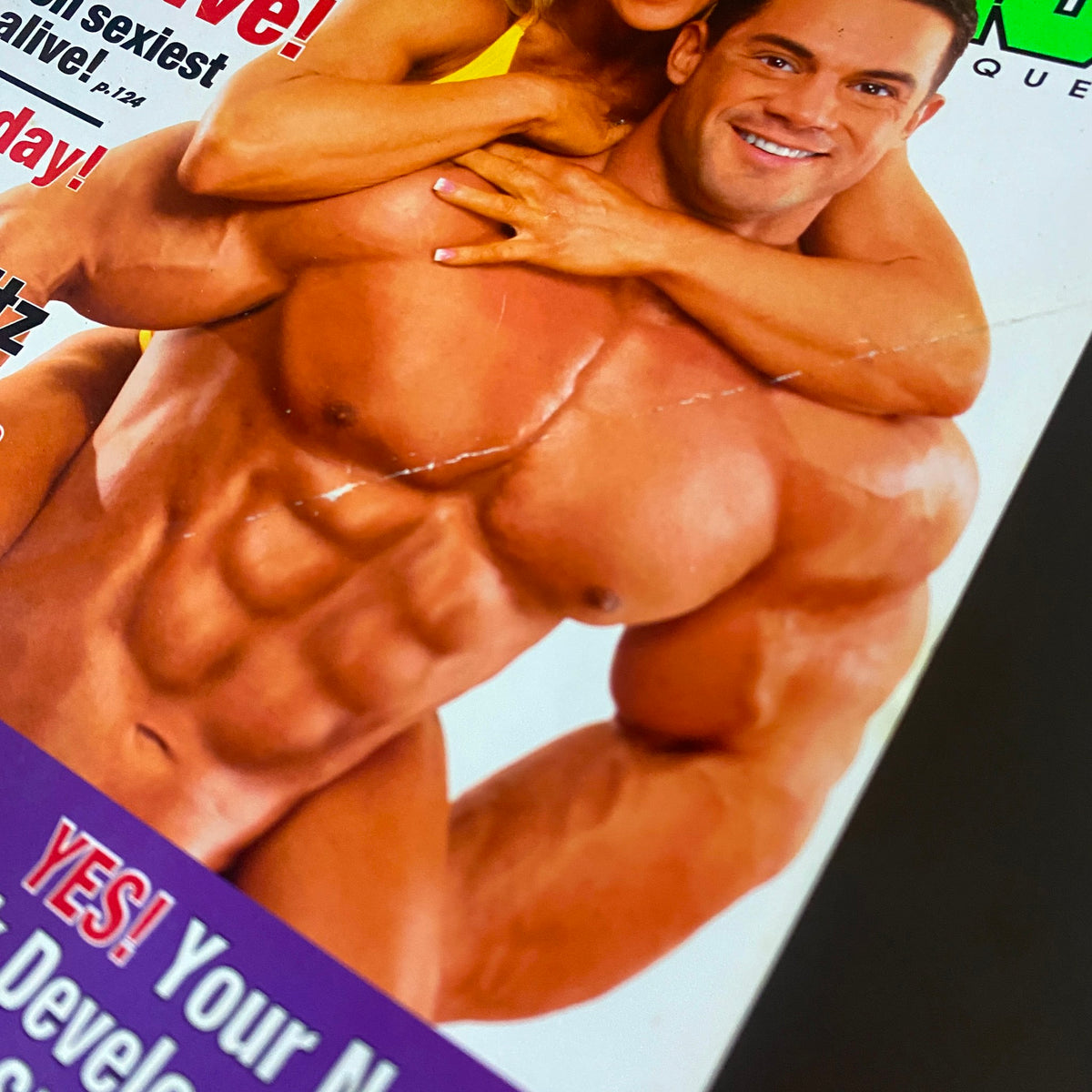 Close-up of the cover of MuscleMag International Magazine May 2005 No. 275 displaying the muscular physique of Scott Peckham with Monica Brant, emphasizing fitness and bodybuilding.