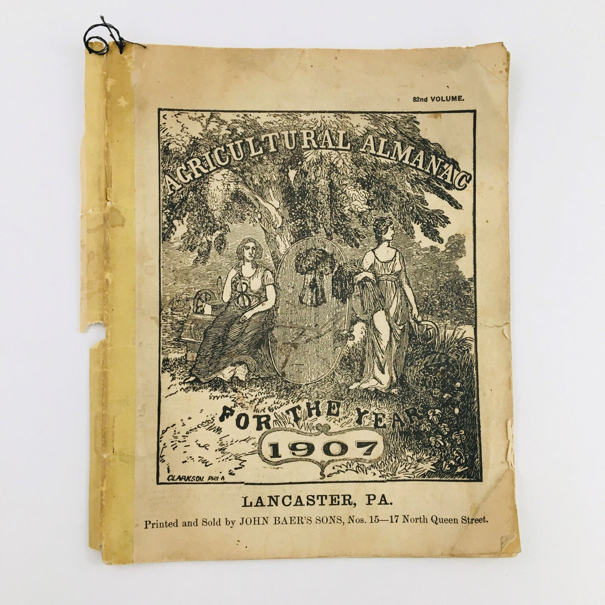 Cover of the Agricultural Almanac For The Year Of Our Lord 1907 showcasing an illustrated design with a tree and two women, published in Lancaster, PA.