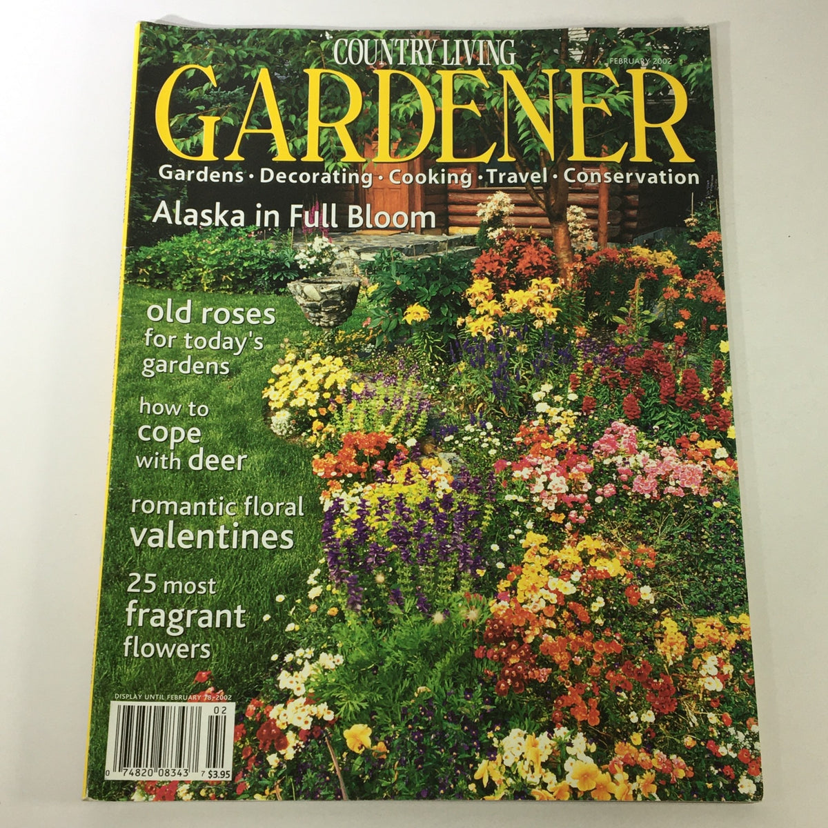 Cover of 'Country Living Gardener Magazine February 2002 - Alaska in Full Bloom Flowers' featuring a vibrant garden filled with colorful flowers, showcasing gardening tips and flora specific to Alaska.