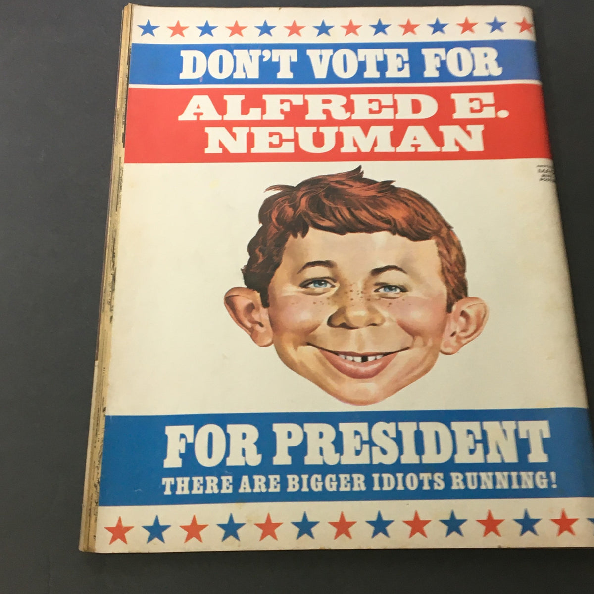 Back cover of Mad #187 December 1976 with character Alfred E. Neuman's humorous campaign slogan 'DON'T VOTE FOR ALFRED E. NEUMAN FOR PRESIDENT', showcasing the magazine's satirical style.