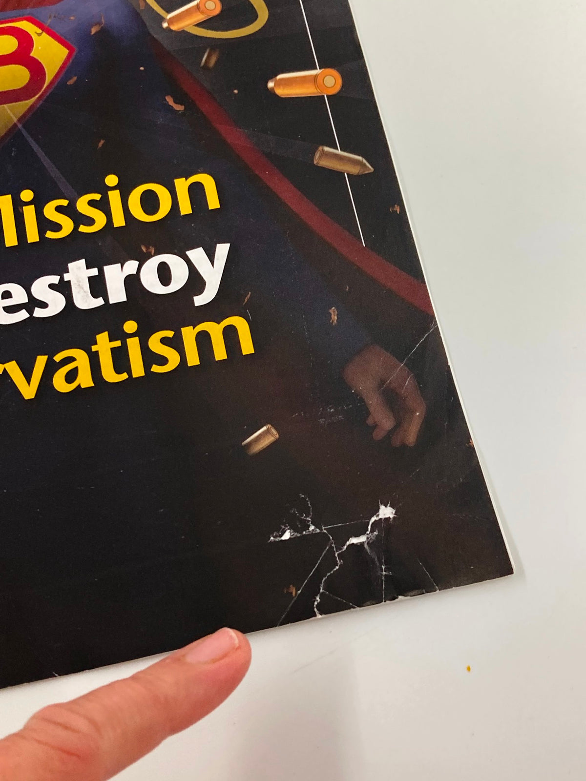 Close-up view of the damage on the Rush Limbaugh Letter Magazine March 2013 cover, showing a torn area and creases near the tagline 'Their Mission Is to Destroy Conservatism'.