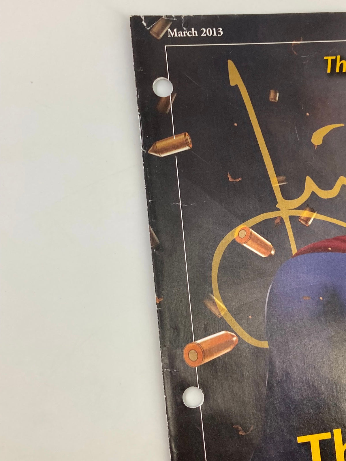 Detail of the hole-punch mechanism on the Rush Limbaugh Letter Magazine March 2013, highlighting its previous binder storage.