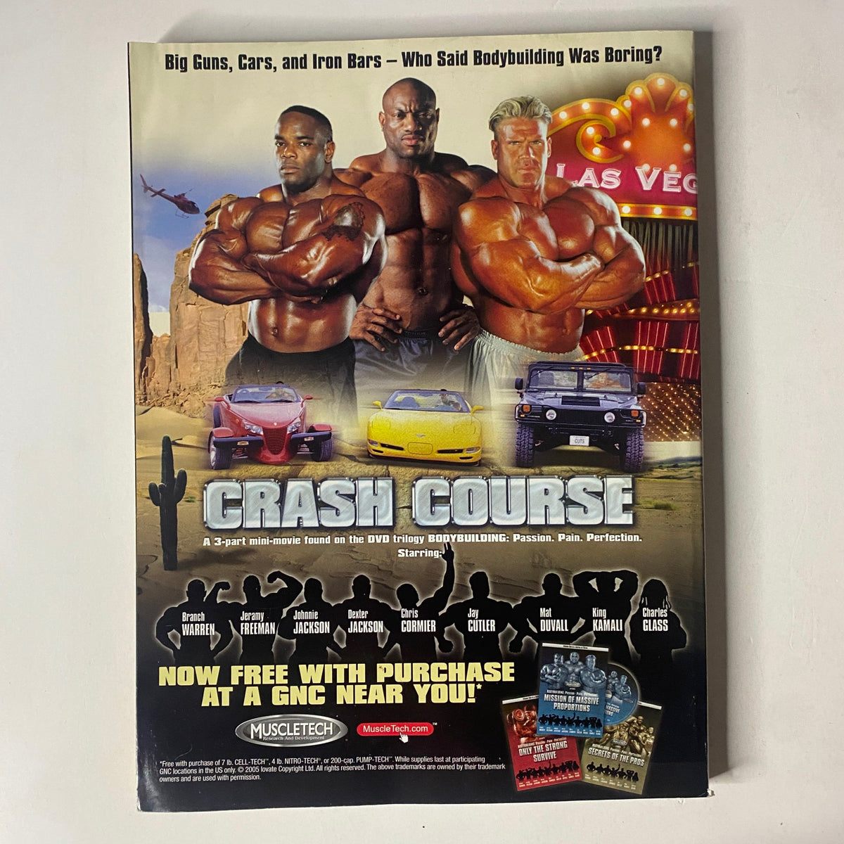 Back cover of MuscleMag International Magazine July 2005 showcasing a promotional mini-movie 'CRASH COURSE' with images of bodybuilders and a background featuring Las Vegas.
