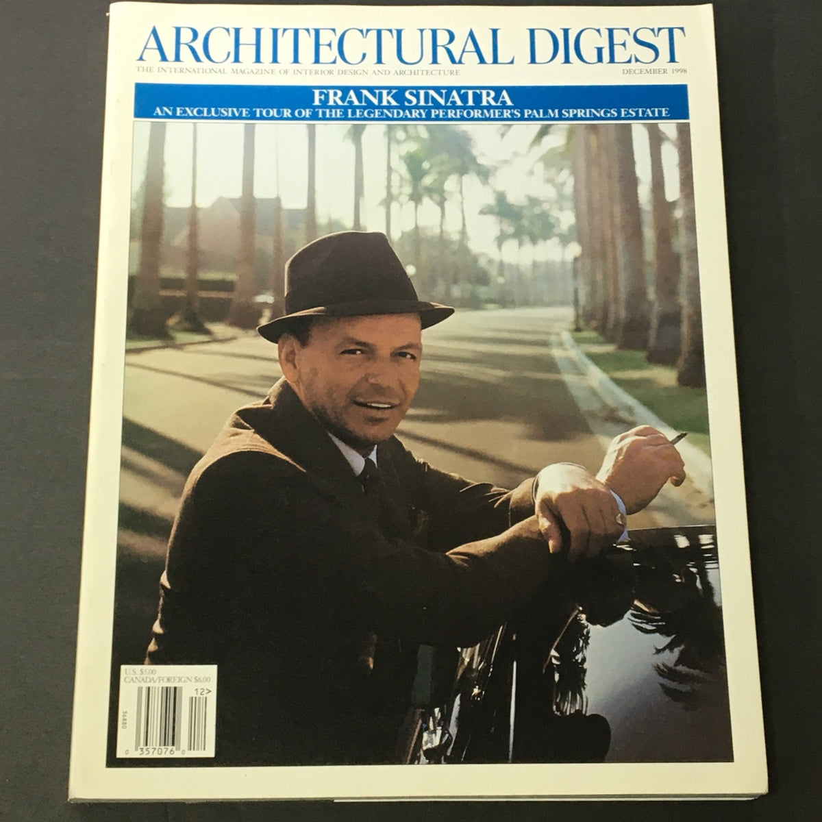 Cover of Architectural Digest Magazine December 1998 featuring Frank Sinatra, showcasing an exclusive tour of the legendary performer's Palm Springs estate with a background of palm trees.