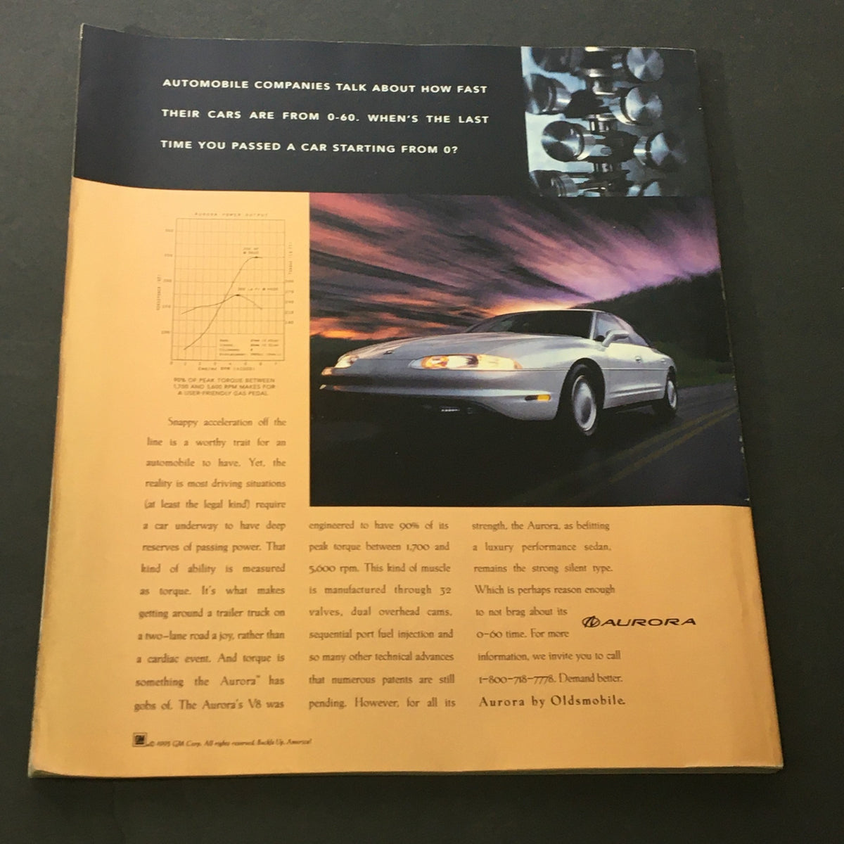 Automobile advertisement featuring the Oldsmobile Aurora, discussing performance metrics and 0-60 acceleration, along with a graph illustrating torque measurements. Part of the George Magazine April May 1996 edition with Tom Brokaw, John Kennedy, and Howard Stern.