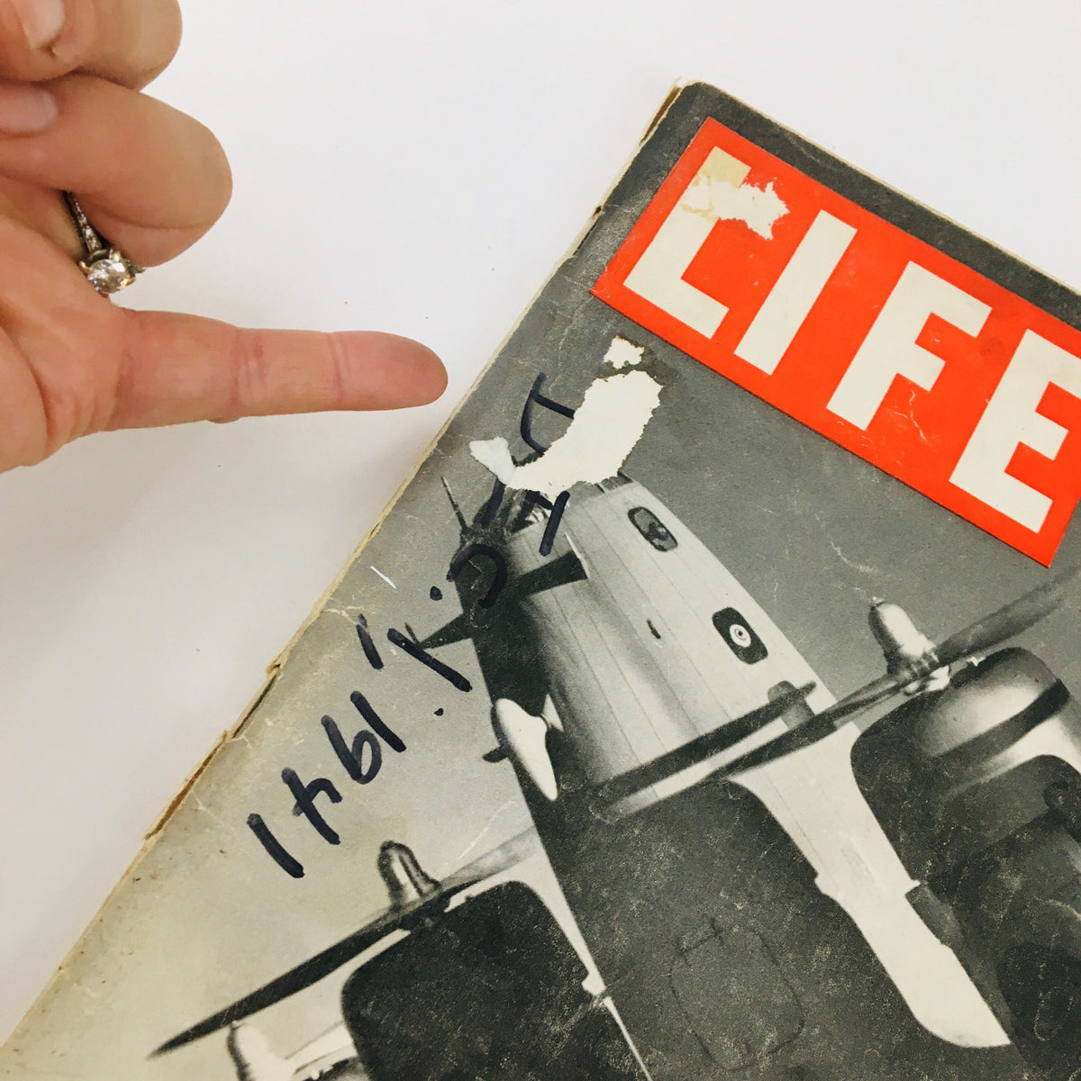 Close-up view of the cover of VTG Life Magazine December 1, 1941, showing the top right corner with a tear and handwritten notes.