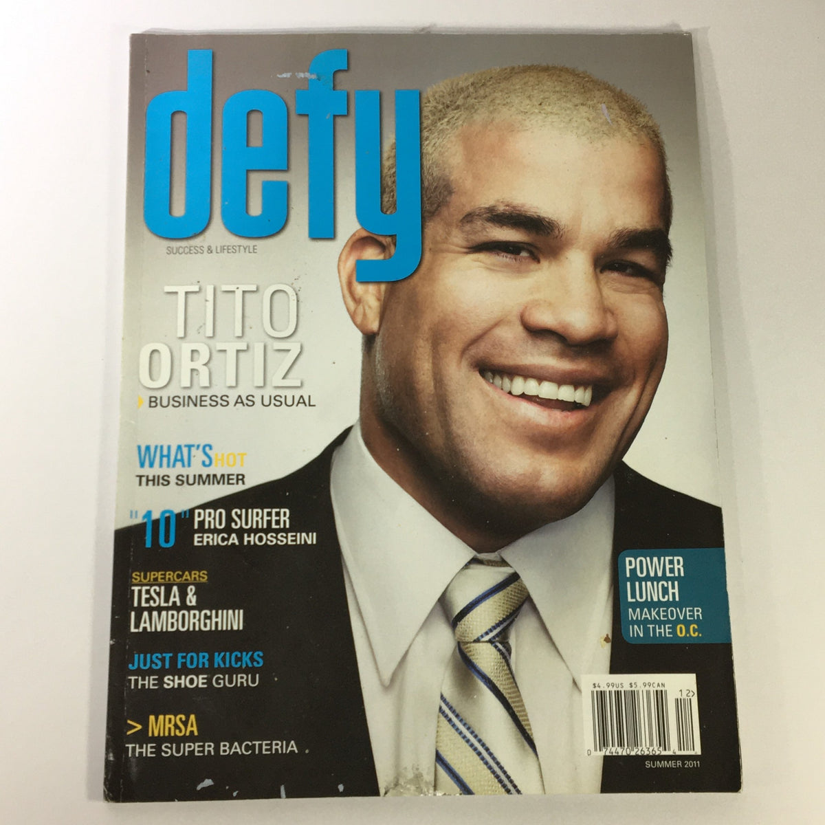 Defy Business Magazine Summer 2001 featuring Tito Ortiz on the cover, showcasing a blend of sports and business themes. The magazine highlights Ortiz's casual yet impactful approach to entrepreneurship, with a clean layout and vibrant colors.