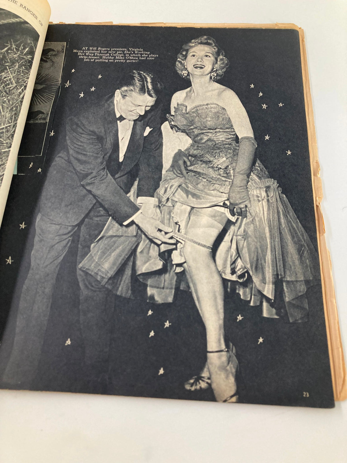 Image from Vintage Movie Life Magazine October 1952 depicting a glamorous actress at a premiere event, showcasing vintage fashion.