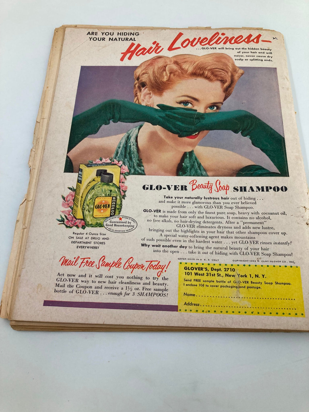 Advertisement for Glo-Ver Beauty Soap Shampoo from VTG Movie Life Magazine October 1952, featuring a glamorous woman with styled hair, promoting hair care products and beauty.