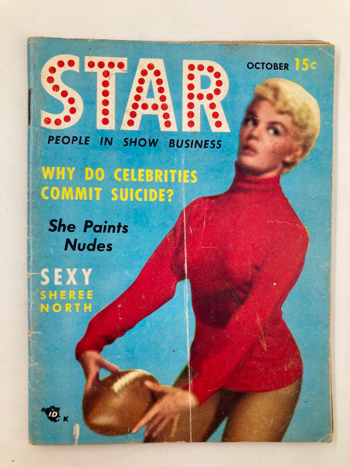 Cover of Star Tabloid Magazine October 1954 Vol. 1 No. 1 featuring the alluring Sheree North in a red sweater, with topics like 'Why Do Celebrities Commit Suicide?' and 'She Paints Nudes.'