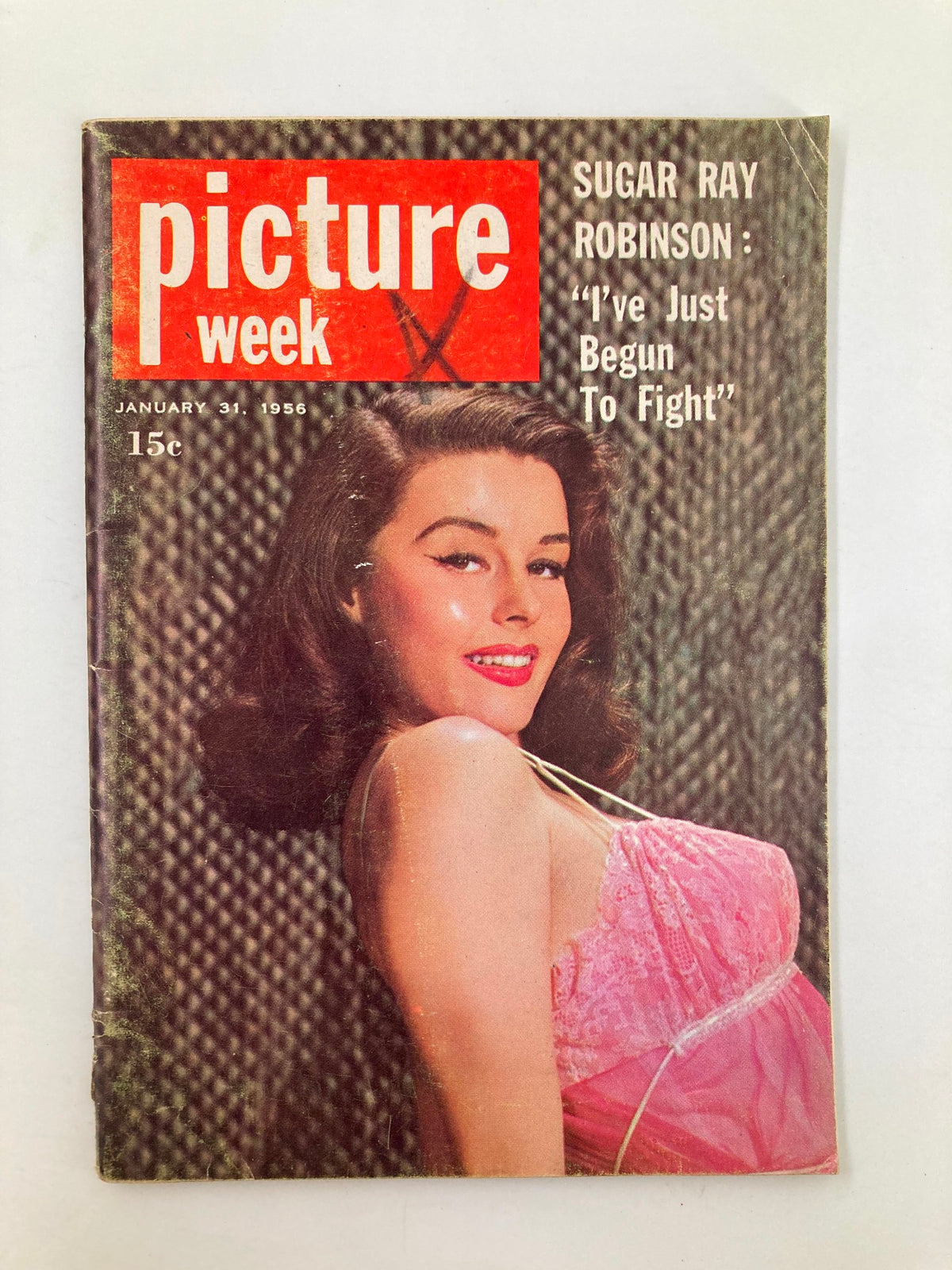 VTG Picture Week Magazine dated January 31, 1956, featuring a vintage cover illustration with a model posing in a pink outfit and the headline 'Sugar Ray Robinson: I've Just Begun To Fight'. This collectible magazine highlights boxing history and is a unique addition for enthusiasts.